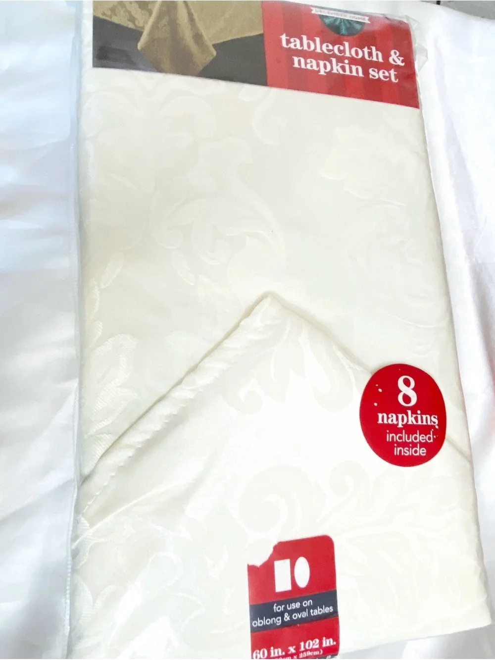 December Home satiny rectangular oblong tablecloth and 8 napkin set 60” x 102”.